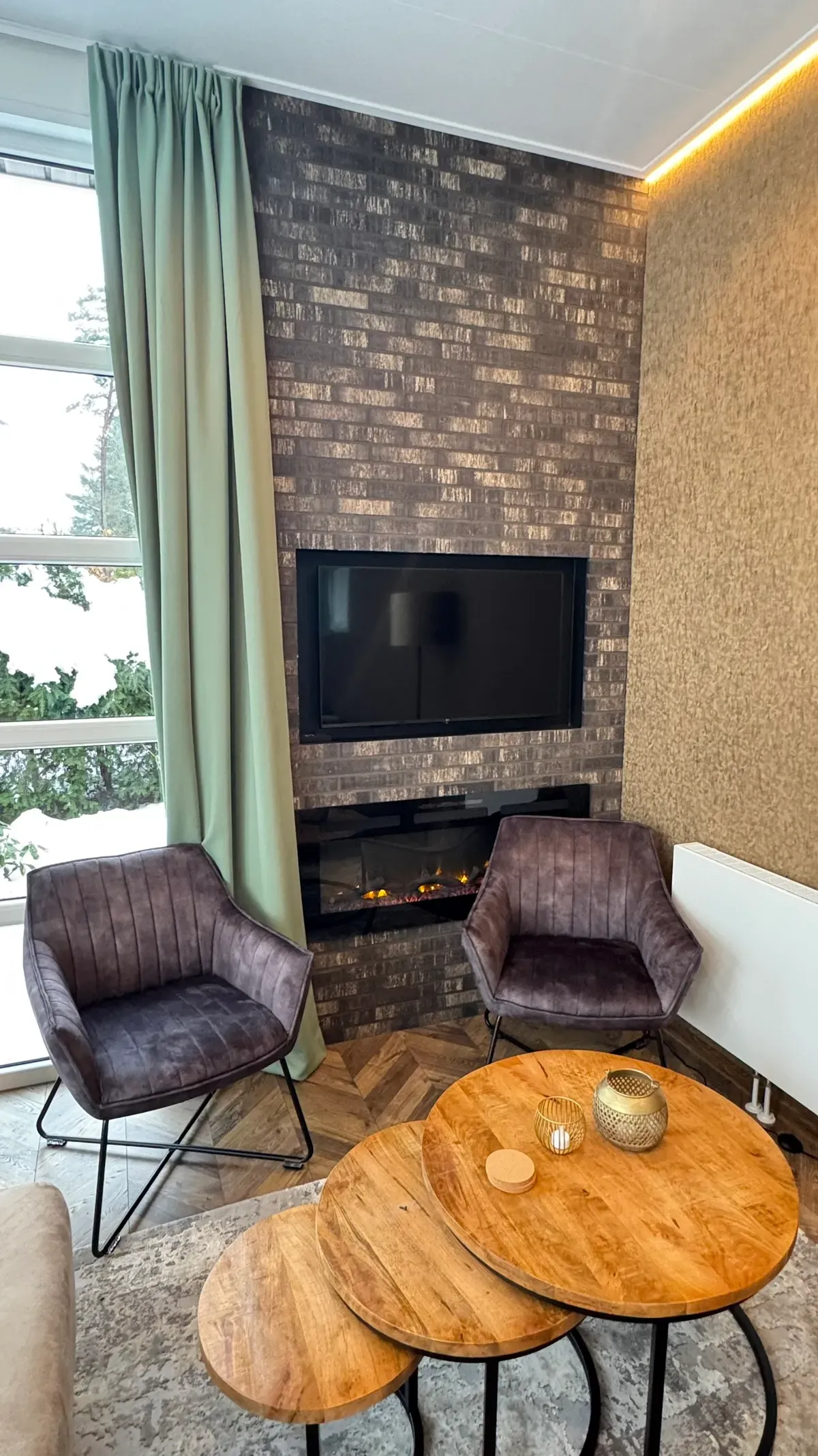 Sfeerhaard in woonkamer vakantiehuis Woeste Hoogte nr 15 - gezellige elektrische haard voor warme avonden